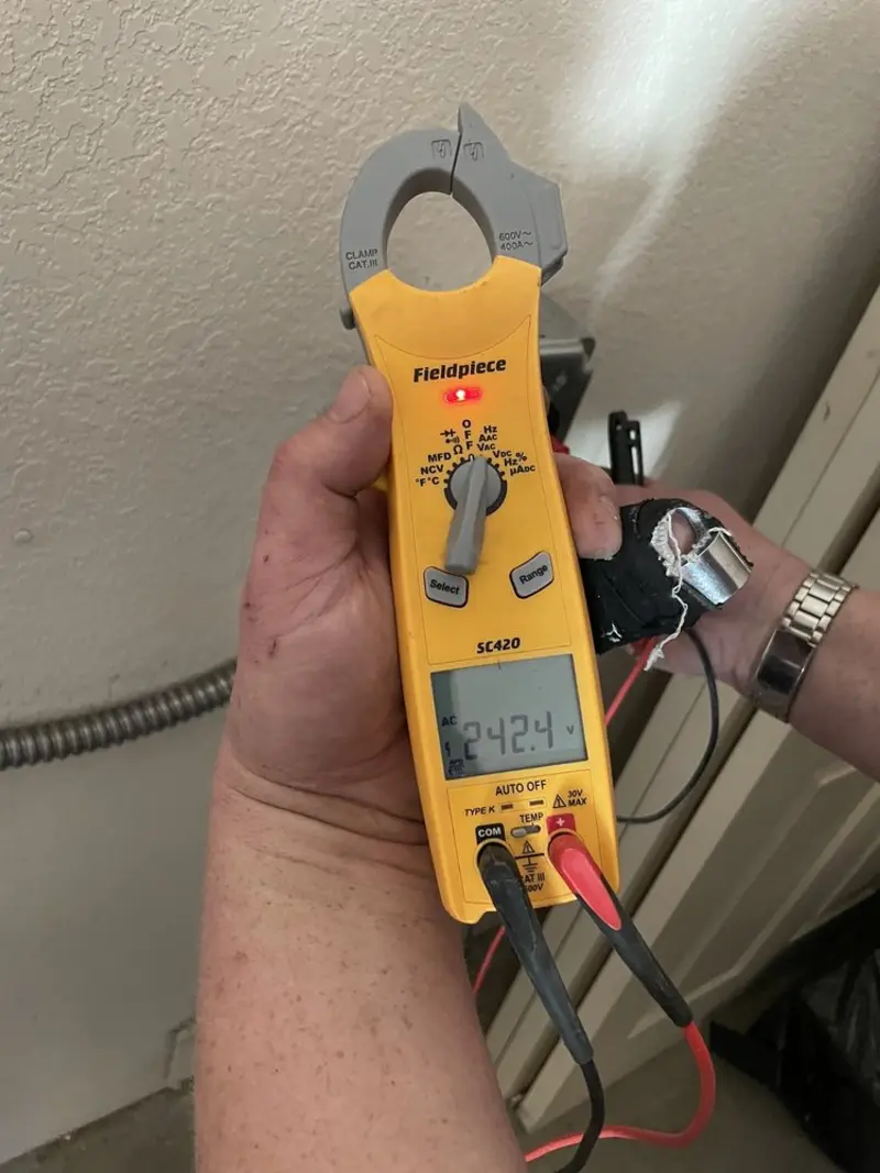 Voltage testing with clamp meter during Electrical Installation Services in Goldenrod